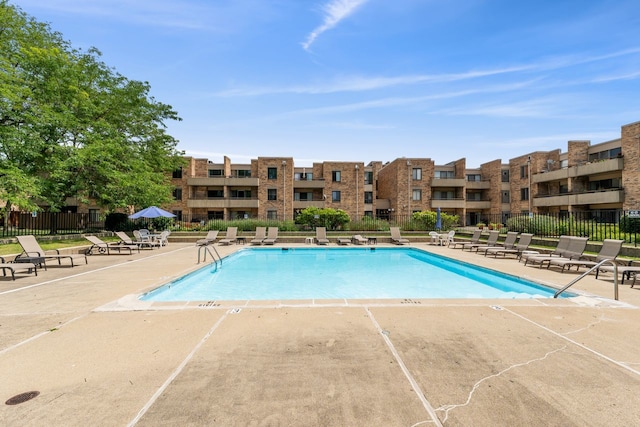 view of swimming pool featuring a patio area