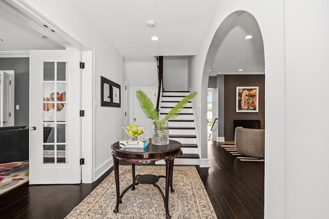 1319 Lincoln St, Evanston, IL 60201 - entrance foyer with arched walkways, recessed lighting, stairway, and wood-type flooring