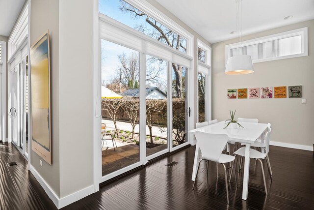 1319 Lincoln St, Evanston, IL 60201 - dining space with dark wood-style floors, baseboards, and visible vents