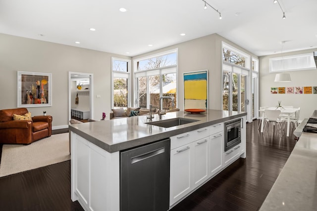 1319 Lincoln St, Evanston, IL 60201 - kitchen with a sink, a kitchen island with sink, appliances with stainless steel finishes, open floor plan, and white cabinetry