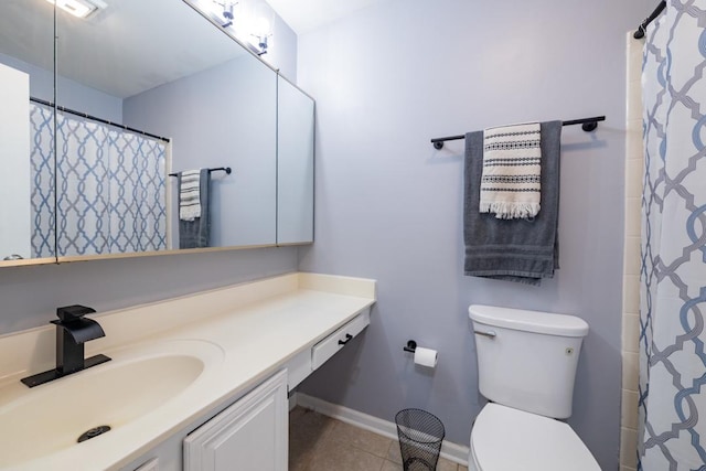 full bath featuring curtained shower, toilet, vanity, tile patterned flooring, and baseboards