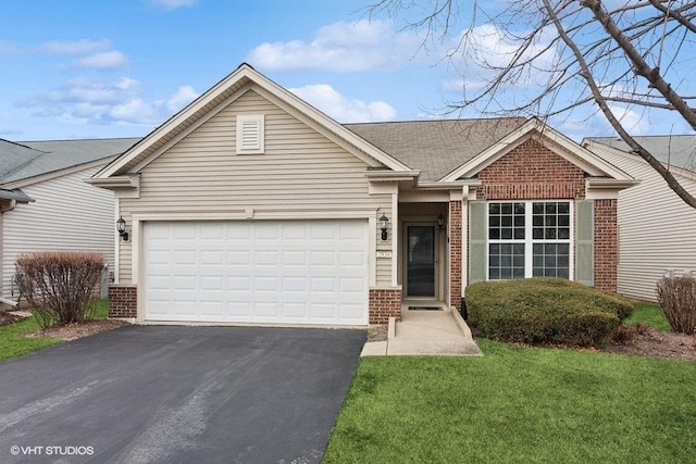 view of front facade with a garage and a front lawn