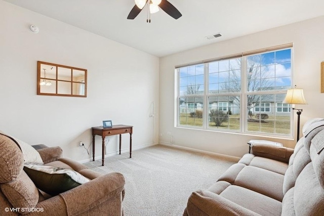 living room featuring vaulted ceiling, light colored carpet, and ceiling fan