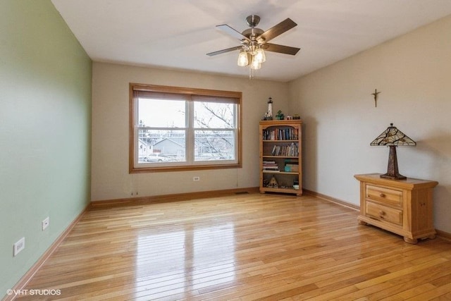 unfurnished room featuring light hardwood / wood-style floors and ceiling fan