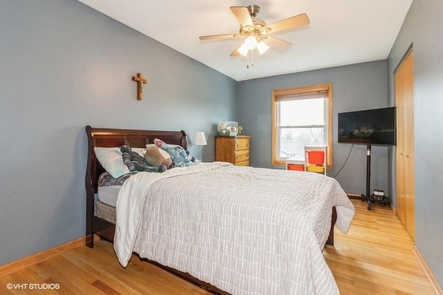 bedroom featuring ceiling fan and light hardwood / wood-style floors