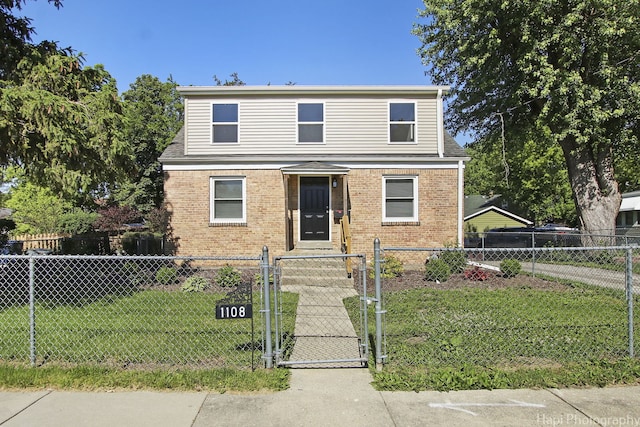 front facade featuring a front yard