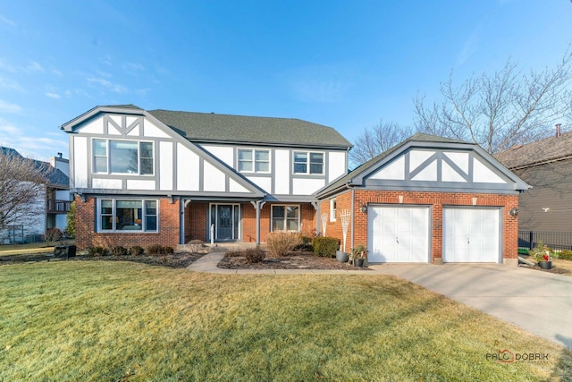 english style home featuring a garage and a front yard