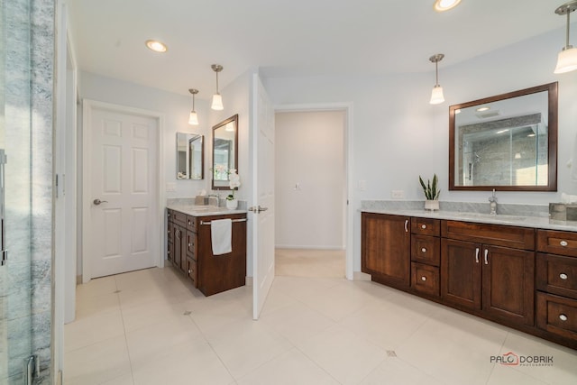 bathroom with vanity and a shower with shower door