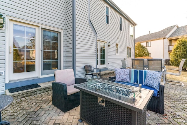 view of patio with a fire pit