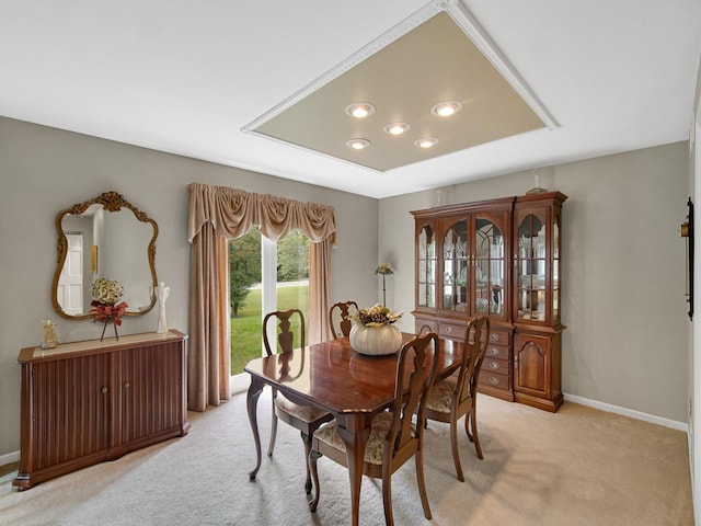 dining room featuring light carpet