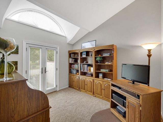 living room with french doors, vaulted ceiling, and light carpet