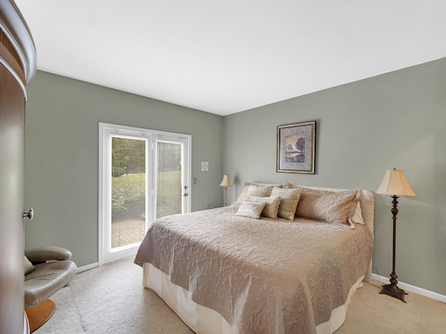 carpeted bedroom featuring access to exterior