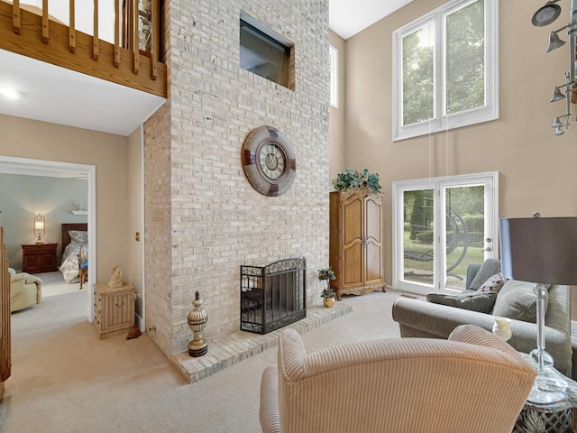 carpeted living room with a towering ceiling and a fireplace