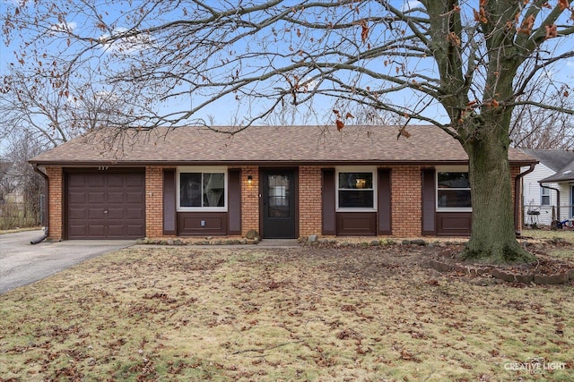 ranch-style home featuring a garage