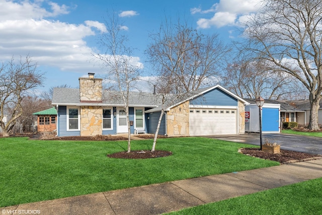 ranch-style home featuring a garage and a front yard