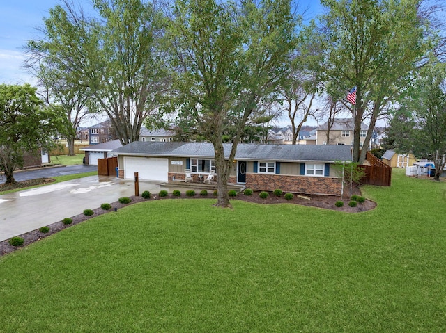 single story home with a garage and a front lawn