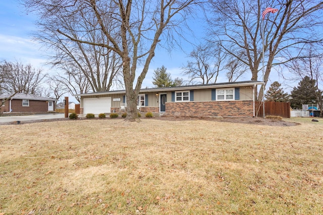 ranch-style home with a garage and a front lawn