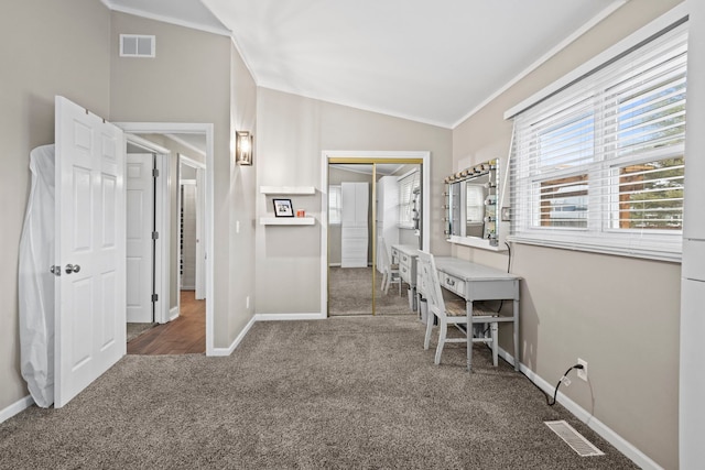 interior space featuring lofted ceiling, crown molding, and carpet floors