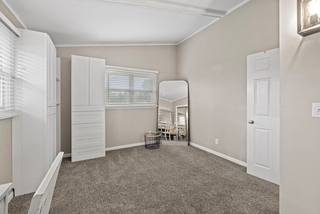 carpeted bedroom featuring lofted ceiling