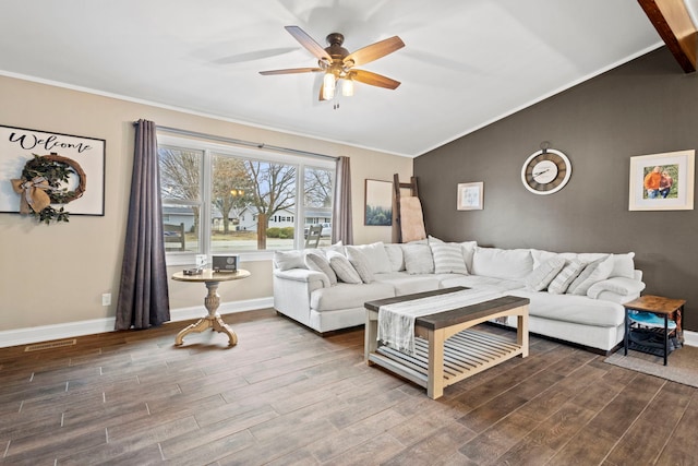 living room featuring hardwood / wood-style flooring, vaulted ceiling, ornamental molding, and ceiling fan