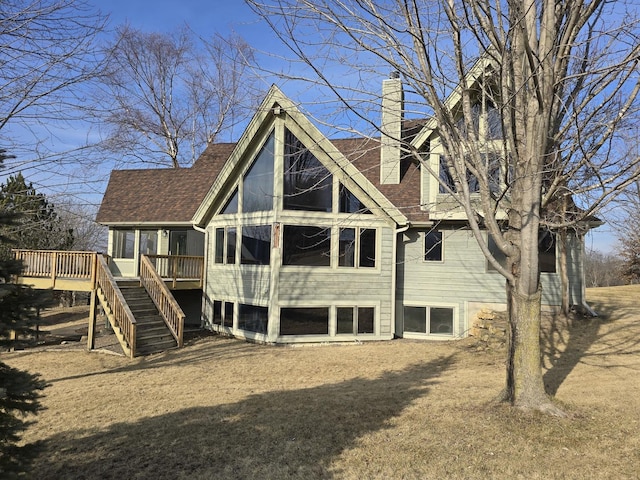 rear view of property with a wooden deck