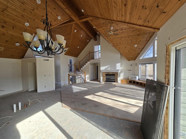 unfurnished living room featuring wood ceiling, beamed ceiling, high vaulted ceiling, and a notable chandelier