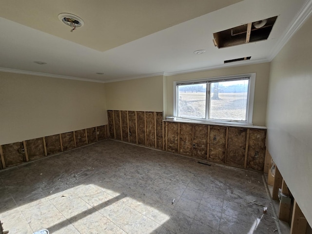 spare room with crown molding