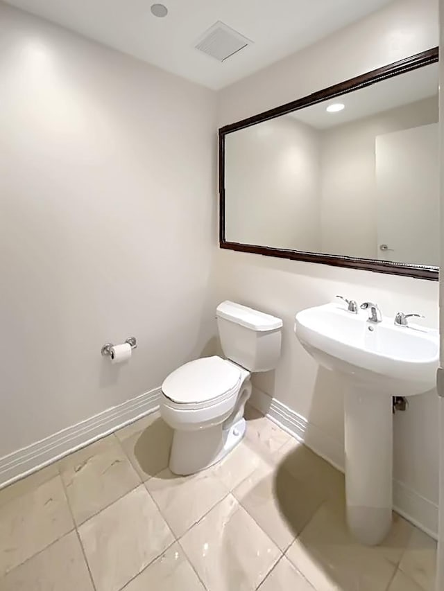 bathroom featuring sink and toilet