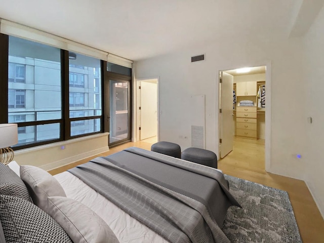 bedroom with light wood-type flooring