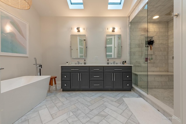 bathroom with vanity, a skylight, and plus walk in shower