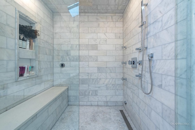 bathroom with tiled shower