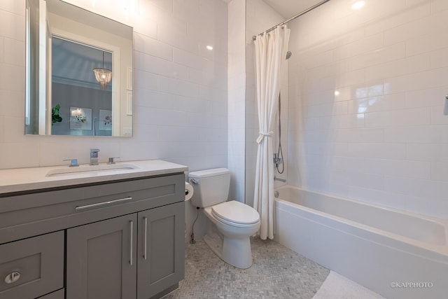 full bathroom with vanity, tile walls, shower / tub combo, and toilet