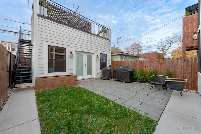 view of patio / terrace featuring grilling area and french doors