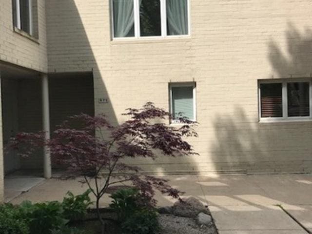 view of side of property featuring a patio area