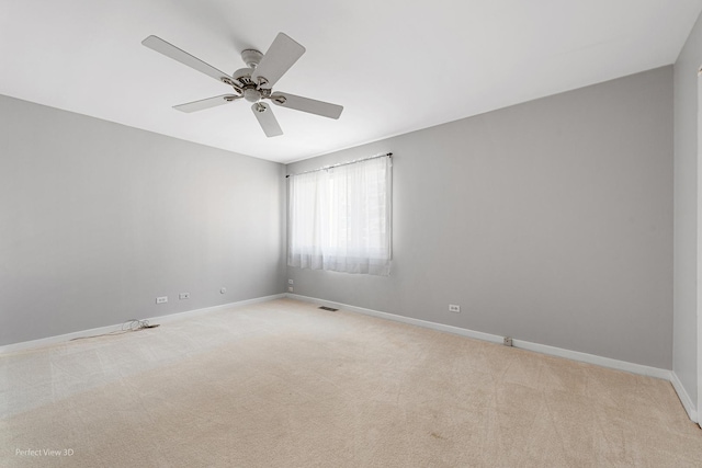 carpeted empty room featuring ceiling fan