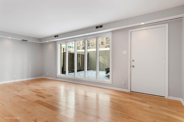 unfurnished room featuring light hardwood / wood-style flooring