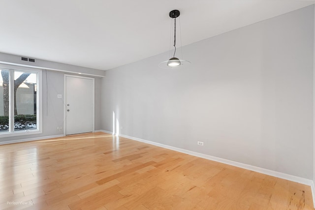 empty room featuring light hardwood / wood-style floors