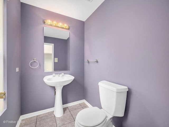 bathroom featuring tile patterned floors and toilet