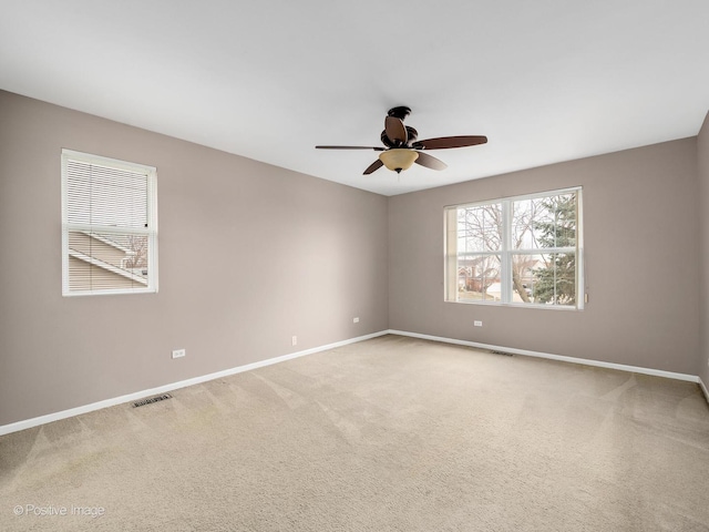 unfurnished room featuring carpet floors and ceiling fan