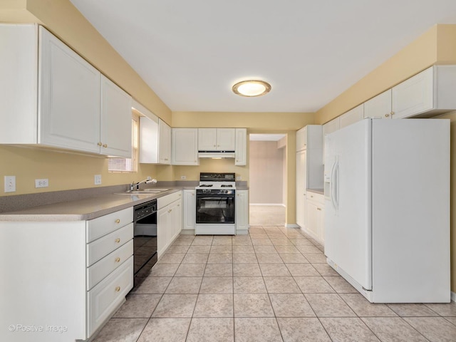 kitchen featuring white cabinetry, sink, light tile patterned flooring, and white appliances