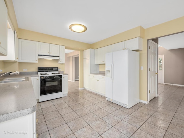 kitchen with light tile patterned flooring, white cabinetry, sink, white fridge with ice dispenser, and gas range oven