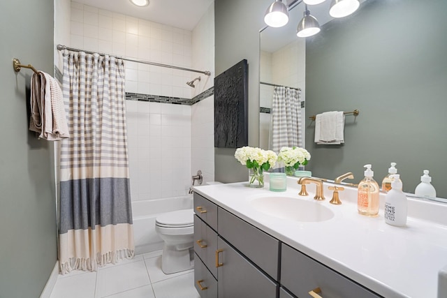 bathroom featuring toilet, tile patterned flooring, shower / tub combo with curtain, and vanity