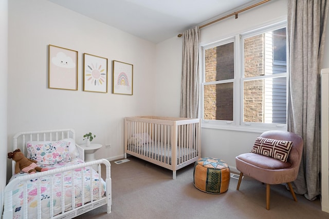 carpeted bedroom featuring baseboards