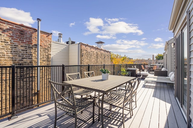 deck featuring outdoor dining area