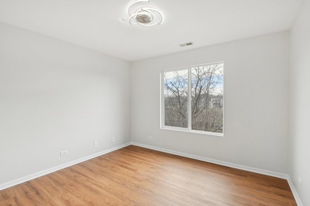 spare room featuring light hardwood / wood-style floors