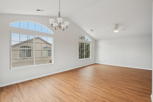 unfurnished living room with high vaulted ceiling, wood-type flooring, and ceiling fan with notable chandelier