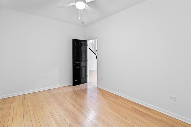 spare room with ceiling fan and light hardwood / wood-style flooring