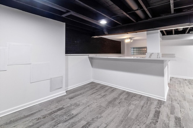 basement with wood-type flooring