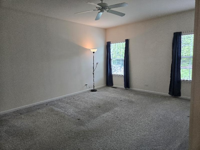 1616 Colchester Ln, Aurora, IL 60502 - carpeted empty room with a ceiling fan and baseboards
