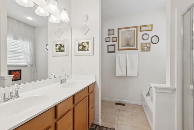 1616 Colchester Ln, Aurora, IL 60502 - bathroom with tile patterned flooring, double vanity, baseboards, a tub to relax in, and a shower with door